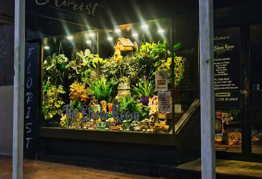 A florist shop window at night